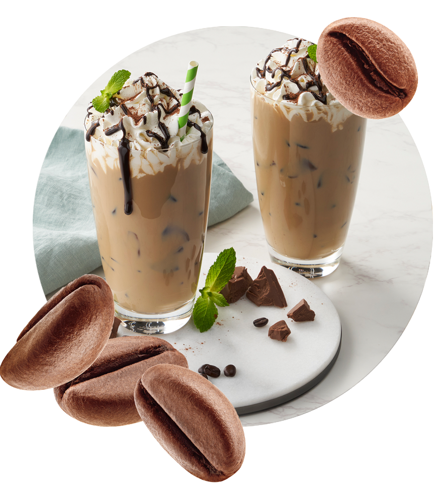 Two glasses of chocolate milkshakes on a plate