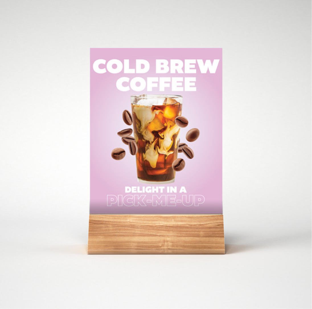 A sign that says "cold brew coffee delight" in a drinkmeup