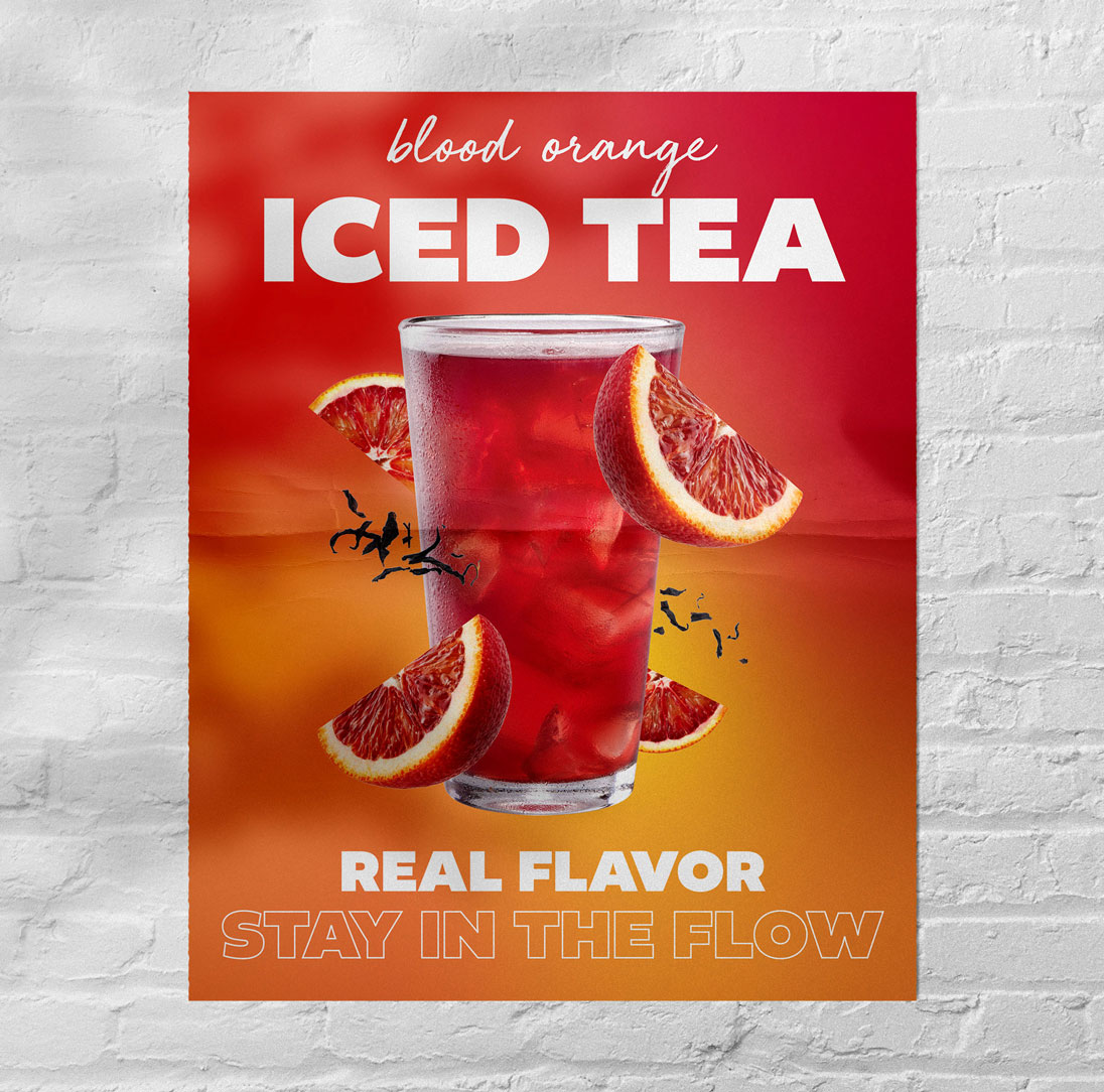 A poster on a brick wall advertising iced tea