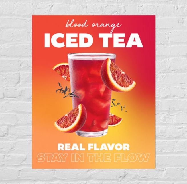 A poster on a brick wall advertising iced tea